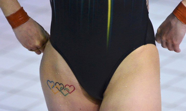 Image: A view shows an Olympic-themed tattoo on Australia's Melissa Wu, as she competes in the women's 10m platform preliminary round diving competition at the London 2012 Olympic Games at the Aquatics Centre